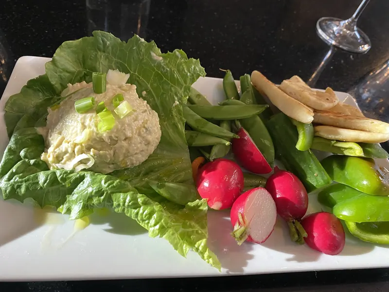 Curry chicken salad on greens with radishes and grilled bread