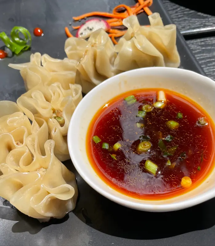 Hand-folded dumplings with a chilli dipping sauce