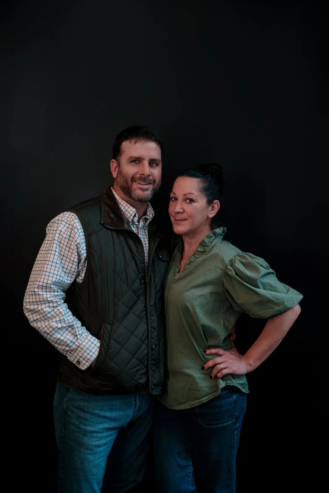 Bryan and Melanie McCaffree, the founders of Bistro Ten, photographed against a dark backdrop