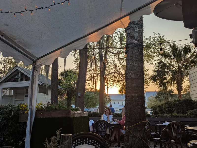 The patio at dusk under string lights