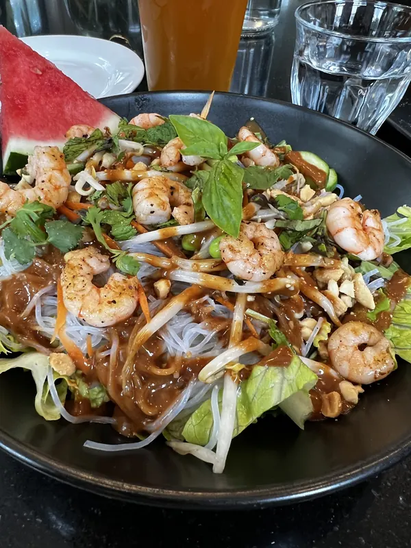 A shrimp and noodle salad with fresh herbs
