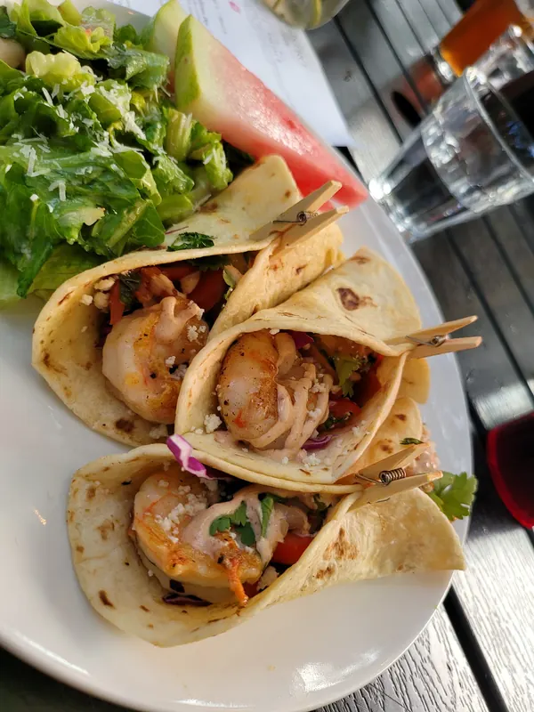 Shrimp tacos with salad on the patio